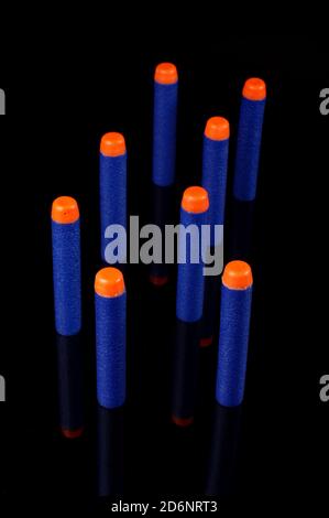 Toy gun bullets made from foam and rubber isolated on the black background Stock Photo