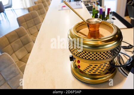 Close up of making coffe in Turkish coffee brewing pot Stock Photo