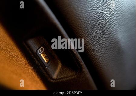 Close up of car interior usb charging cable connection Stock Photo