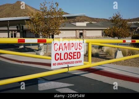 Close up of school campus closed sign on gate Stock Photo