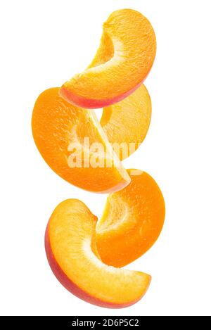falling apricot slices isolated on a white background. Stock Photo