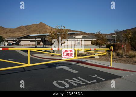 Wide angle view of chool campus closed sign on gate Stock Photo