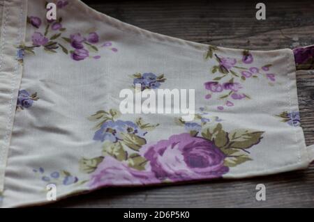 Fragment of colorful retro tapestry textile pattern with floral ornament useful as background. Floral textile or cloth Stock Photo