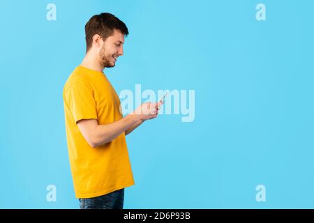 Portrait of young guy using his mobile phone Stock Photo