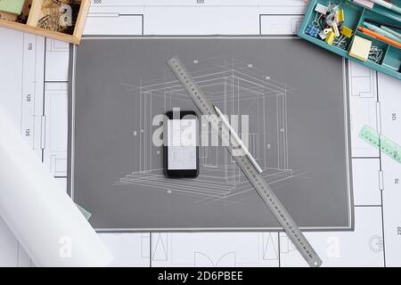 Above view background of blueprints and plans on drawing desk at architects workplace, copy space Stock Photo