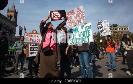 Boston, Massachusetts, USA. October 18, 2020, Copley Square, Boston, Massachusetts, USA: A Trump supporter holds an anti Black Lives Matter sign face off counter protesters during a rally in support of U.S. President Donald Trump sponsored by Super Happy Fun America, in Boston. Credit: Keiko Hiromi/AFLO/Alamy Live News Stock Photo