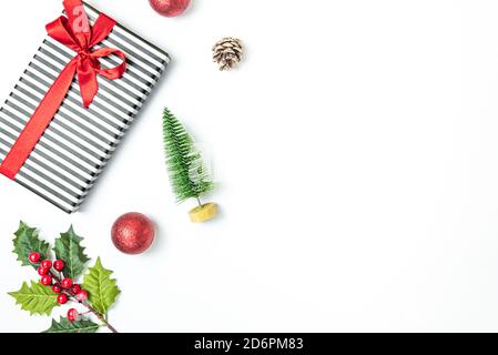 Gift box wrapped in striped black and white over white background. Christmas presents and ornament preparation. Copy space. Stock Photo