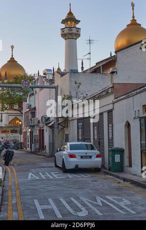 Evening view of the iconic Sultan Mosque from a back alley of Muscat St. and Baghdad St., in Kampong Glam area of Singapore Stock Photo