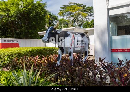 Huber's butchery life-size cow display outdoor with greenery surrounding it. Stock Photo