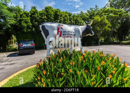 Huber's butchery life-size cow display outdoor with greenery surrounding it. Stock Photo