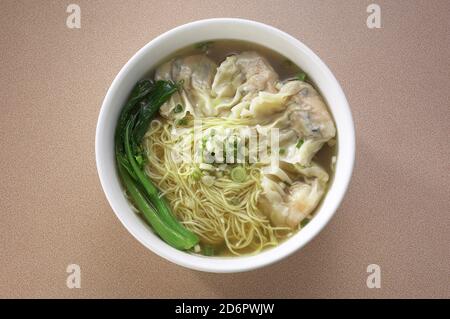 Asian style noodles with wonton stuffed meat dumpling Stock Photo