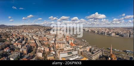 Aerial panoramic drone shot of Hungarian Parliament with clouds in Budapest Winter morning Stock Photo