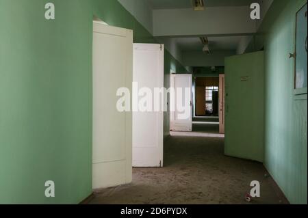 Hallway inside one of the abondoned buildings in the arctic town Pyramiden at Svalbard, Norway. Pyramiden is an abandoned coal mining settlement at Svalbard. The small arctic town was abandoned in 1998. Stock Photo