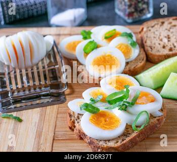 egg sandwiches on a wooden board Stock Photo
