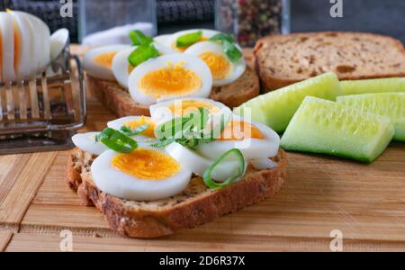 egg sandwiches on a wooden board Stock Photo