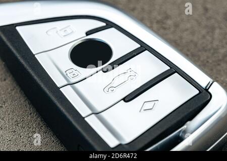 Modern automobile car key on black concrete background Stock Photo