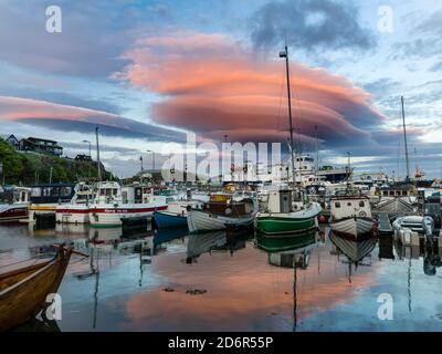 Midnight, atmospheric cloud over the eastern harbour. Torshavn (Thorshavn) the capital of the Faroe Islands on the island of Streymoy in the North Atl Stock Photo