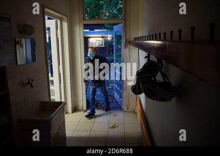 Kiel, Germany. 19th Oct, 2020. A pupil of a sixth grade comes to his classroom at the Max-Planck-Schule Kiel after the autumn holidays for the beginning of the lessons. Credit: Gregor Fischer/dpa/Alamy Live News Stock Photo