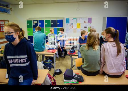 Kiel, Germany. 19th Oct, 2020. Pupils of a sixth grade at the Max Planck School in Kiel are waiting in their classroom for the start of lessons after the autumn holidays. Credit: Gregor Fischer/dpa/Alamy Live News Stock Photo