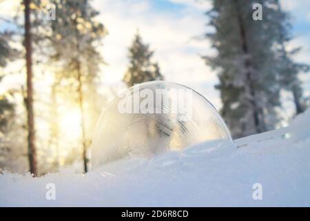 Close up of a frozen sop bubble in the snow in winter Stock Photo