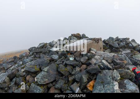 The summit trig point and cairn of the munro mountain of Carn Gorm in Glen Lyon, Perthshire, Scotland, UK Stock Photo