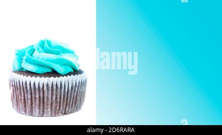 A chocolate cupcake or muffin with blue butter and cheese cream, holiday, party concept, greeting card Stock Photo