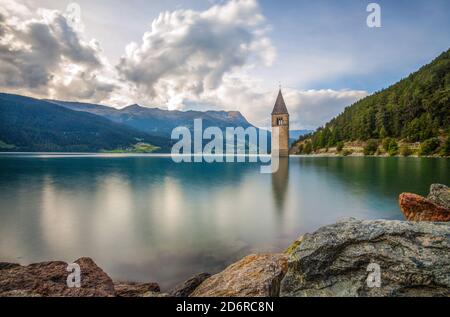 The bell tower of the sunken church in Curon, Resia Lake, Bolzano province, South Tyrol, Italy. Stock Photo