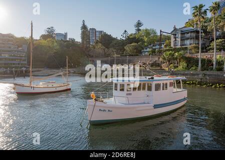 Pleasure boats moored in the late afternoon sun on Lavender Bay in Sydney Harbour, New South Wales, Australia Stock Photo