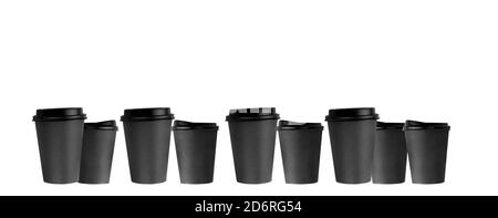 several black paper coffee cups in a row, a banner of disposable cups. Stock Photo