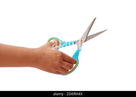 Hand is holding scissors isolated on a white background with the clipping path. Stock Photo