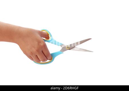 Hand is holding scissors isolated on a white background with the clipping path. Stock Photo