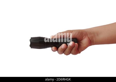 Black flashlight in human hands, isolated on a white background with the clipping path. Stock Photo