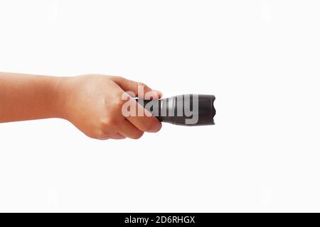Black flashlight in human hands, isolated on a white background with the clipping path. Stock Photo