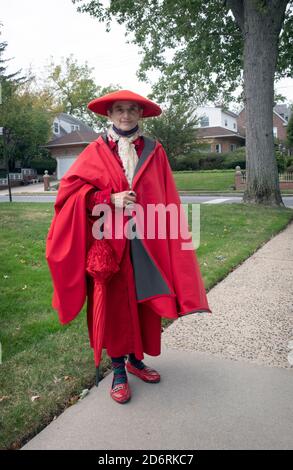 Posed portrait of a woman dressed almost entirely in red. In Flushing, Queens, New York City. Stock Photo