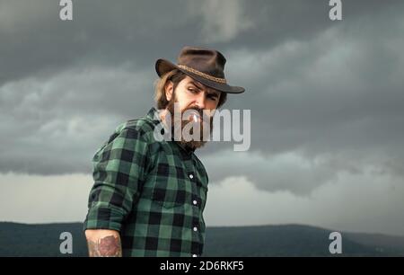 Fashion portrait of man. Mature hipster with beard. brutal caucasian hipster with moustache. Male barber care. Bearded man in cowboy hat. wild wild west. Confident and handsome brutal man. texas trip. Stock Photo