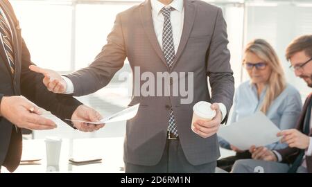 office employees discussing business documents. office workdays. Stock Photo