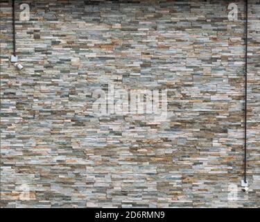 Stone wall with security cameras Stock Photo