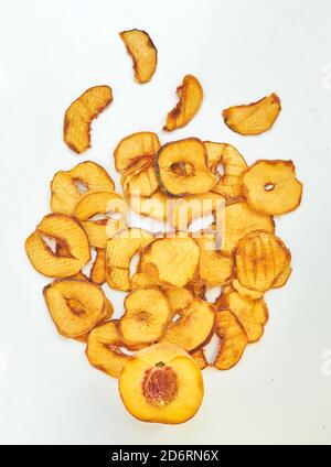 Flat lay composition with fresh and dried peach slices on white background. Stock Photo