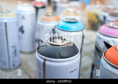 Used cans of spray paint in a bag Stock Photo - Alamy
