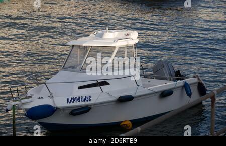 Small boat named Happy Days  in Portreath Harbour, Cornwall, UK Stock Photo