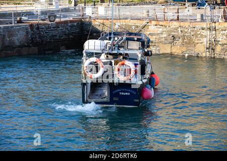 Small boat in Portreath Harbour, Cornwall, UK Stock Photo