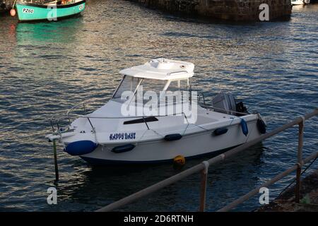 Small boat named Happy Days  in Portreath Harbour, Cornwall, UK Stock Photo