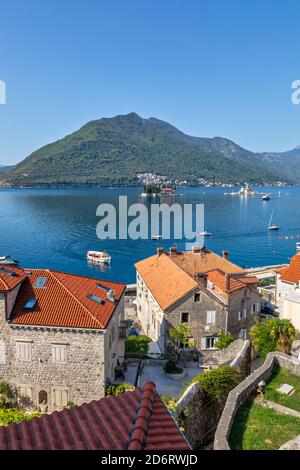 Top view of the houses and streets of the old coastal town of Perast, located in the Bay of Kotor, Montenegro. Stock Photo