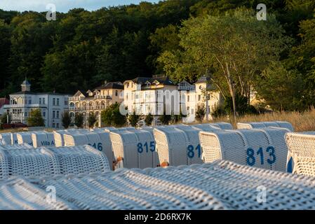 05 August 2020, Mecklenburg-Western Pomerania, Binz: At the beach of the Baltic resort Binz the beach chairs are close together. Behind them are pensions and hotels in the style of the spa architecture. Photo: Stephan Schulz/dpa-Zentralbild/ZB Stock Photo