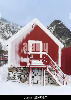 Traditional fishermens hut or Rorbu.  Village Ramberg on the island Flakstadoya.  The Lofoten Islands in northern Norway during winter. Europe, Scandi Stock Photo