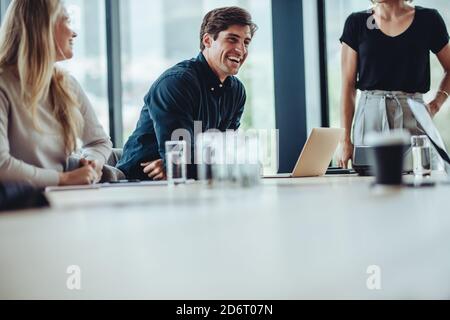 Team of corporate professionals having friendly discussion in a meeting. business team having project discussion in conference room. Stock Photo