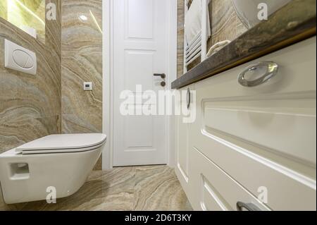 Luxury bathroom with beige marble tiles Stock Photo