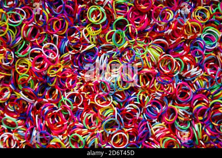 Lot of small and colored rubber bands for use as a background. Stock Photo