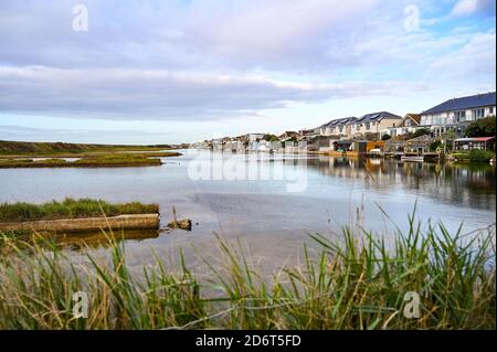 Lancing Widewater Lagoon nature reserve with homes overlooking the water West Sussex England UK Stock Photo