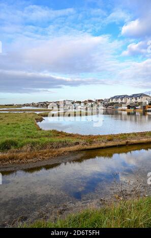 Lancing Widewater Lagoon nature reserve with homes overlooking the water West Sussex England UK Stock Photo